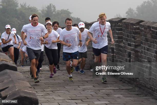 Crown Prince Frederik of Denmark runs with students during the SDC Inauguration Run on September 25, 2017 at Mutianyu's Great Wall, Beijing, China.