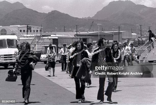 From left, Robert Plant, Jimmy Page, road manager Richard Cole and John Paul Jones of Led Zeppelin arrive at Honolulu airport in Hawaii, United...
