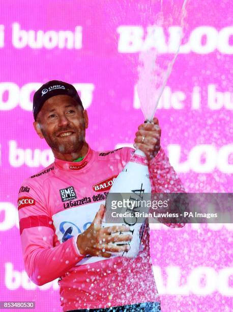 Svein Tuft celebrates after Orica GreenEDGE won the Team Time Trial and he won the maglia rosa during the of the 2014 Giro D'Italia in Belfast.