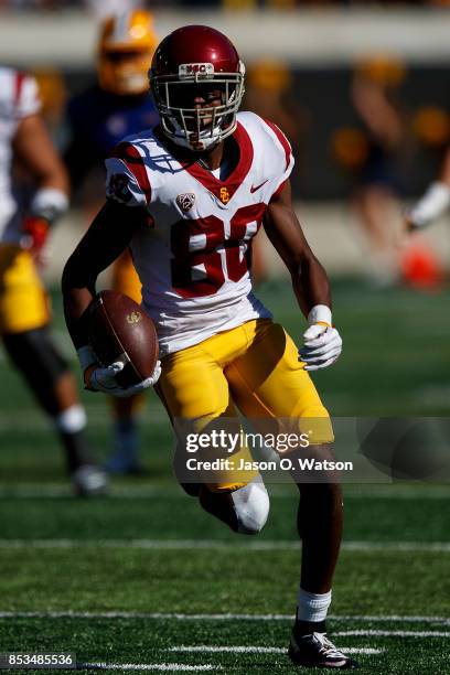 Wide receiver Deontay Burnett of the USC Trojans rushes up field after a pass reception against the California Golden Bears during the fourth quarter...