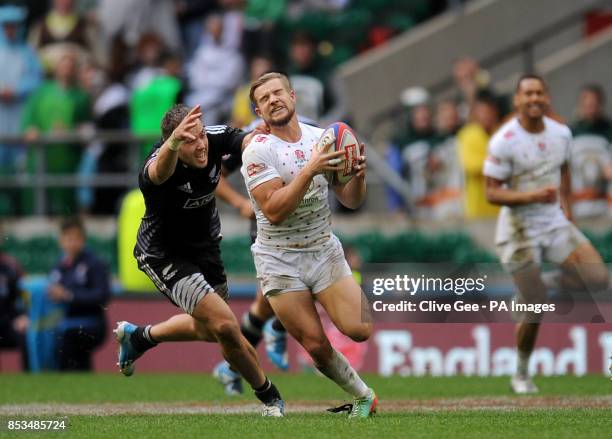 England's Tom Mitchell is tackled by New Zealand's Tim Mikkelson, which was deemed to be a high tackle which he was sin binned for, during Match 24...