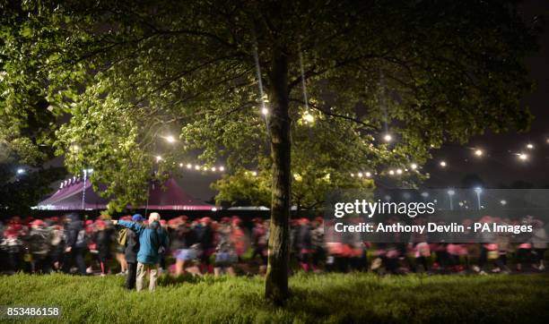 Entrants participate in The MoonWalk London 2014 as over 17,000 women and men wearing brightly decorated bras power walk through the streets of...