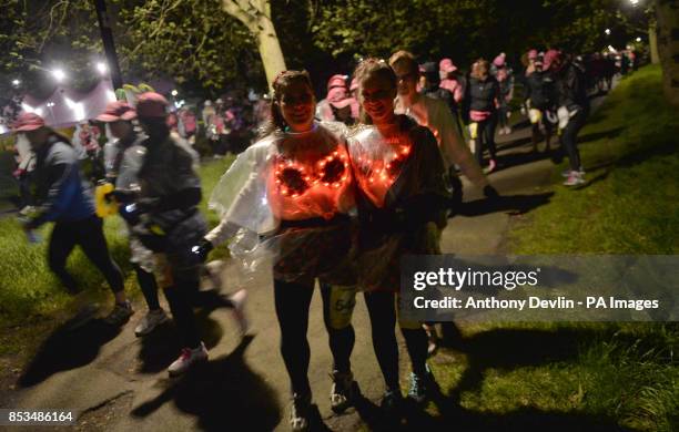 Entrants participate in The MoonWalk London 2014 as over 17,000 women and men wearing brightly decorated bras power walk through the streets of...