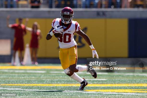 Wide receiver Deontay Burnett of the USC Trojans rushes up field against the California Golden Bears during the first quarter at California Memorial...