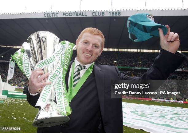 Celtic Manager Neil Lennon poses with the trophy following the Scottish Premiership match at Celtic Park, Glasgow.