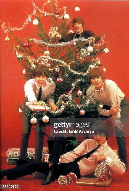 Photo of BEATLES; The Beatles at Christmas, clockwise from left - Paul McCartney, Ringo Starr, John Lennon and George Harrison