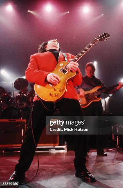 Photo of Gary MOORE; Gary Moore performing on stage, Gibson Les Paul guitar