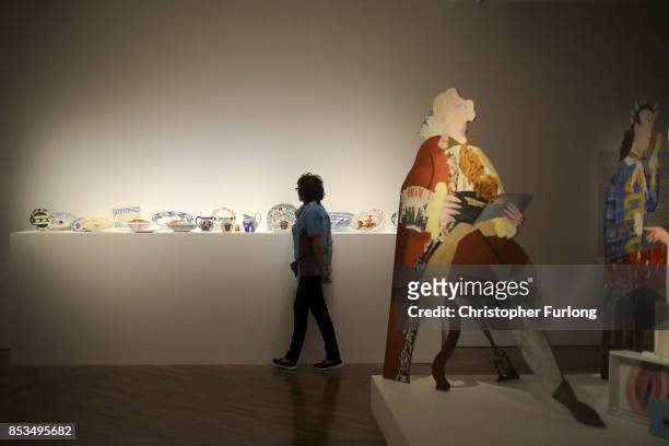 Gallery volunteer views Swallow Hard: The Lancaster Dinner Service, by artist Lubaina Himid installation during a press preview for the 2017 Turner...