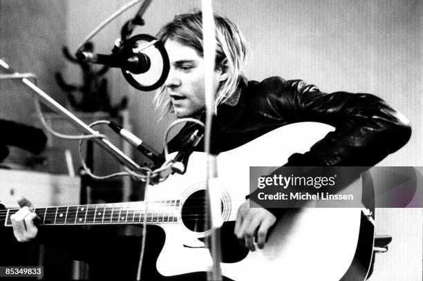 Photo of Kurt COBAIN and NIRVANA, Kurt Cobain recording in Hilversum studios, playing acoustic guitar