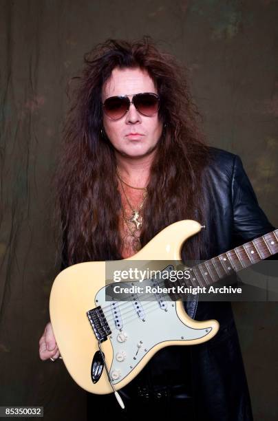 Photo of Yngwie MALMSTEEN, Posed portrait of Yngwie Malmsteen at his RockWalk induction - Fender Stratocaster guitar