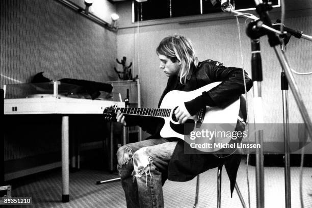 Photo of Kurt COBAIN and NIRVANA, Kurt Cobain recording in Hilversum studios, playing acoustic guitar