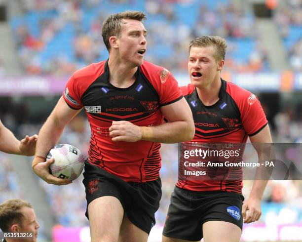 Salford Red Devils' Matty Ashurst celebrates after scoring a try during the First Utility Super League Magic Weekend match at the Etihad Stadium,...