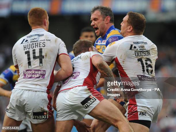 Leeds Rhinos' Jamie Peacock reacts as he is surrounded by Wigan Warriors' players during the First Utility Super League Magic Weekend match at the...