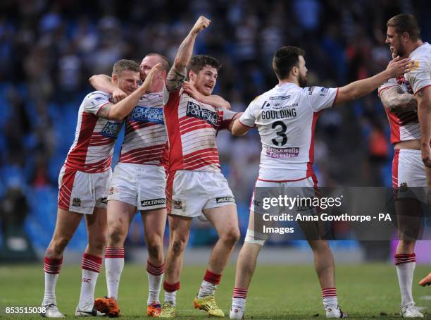 Wigan Warriors' players celebrate beating Leeds Rhinos during the First Utility Super League Magic Weekend match at the Etihad Stadium, Manchester.