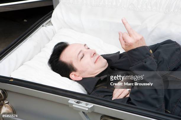 Photo of TEXAS CHAINSAW TRAVELLING HORROR and Dave VANIAN and DAMNED, Dave Vanian lying in a coffin to promote show with the Texas Chainsaw...