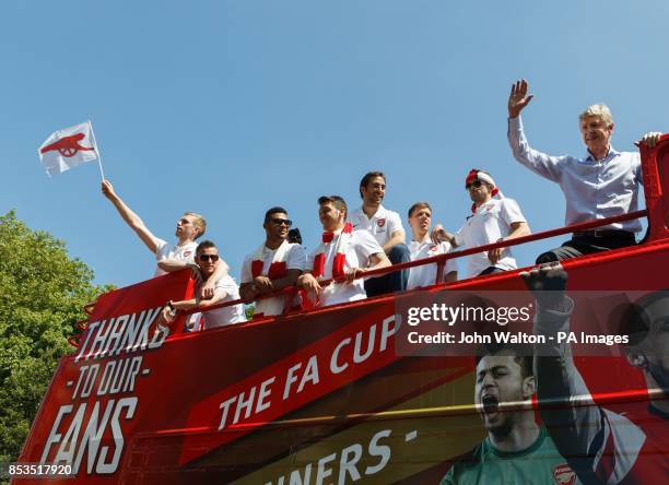 Arsenal manager Arsene Wenger waves to the fans during the FA Cup winners parade at Islington Town Hall, London.