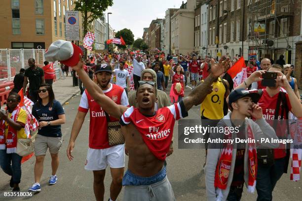 Arsenal walk through the streets following the FA Cup winners parade in London.