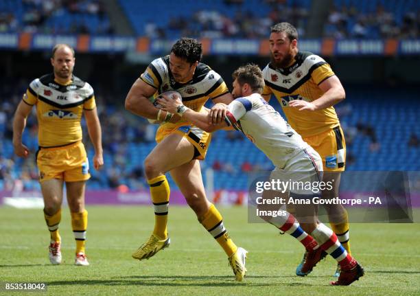 Castleford Tigers' Frankie Mariano beats Wakefield Wildcats' Jarrod Sammut as he goes on to score a try during the First Utility Super League Magic...