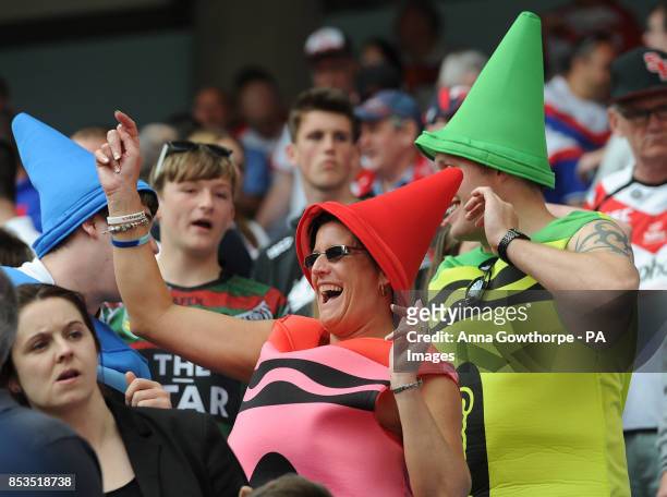 Rugby league fans enjoy themselves in the stands during the First Utility Super League Magic Weekend match at the Etihad Stadium, Manchester.
