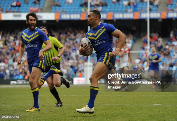 Warrington Wolves' Ryan Atkins runs clear to score a try during the First Utility Super League Magic Weekend match at the Etihad Stadium, Manchester.