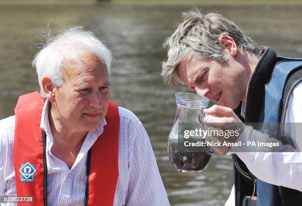 Zac Goldsmith MP joins Andrew Kerr Chairman of the Sustainable Eel Group as they release 10,000 juvenile eels into the River Thames from a boat in...