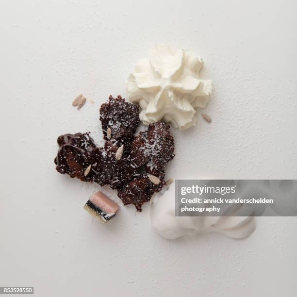 ice cream, whipped cream, lava cake, marzipan, sunflower seeds and coconut rasp. - lakritzmischung stock-fotos und bilder