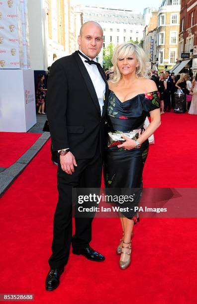 Camille Coduri and guest arriving for the 2014 Arqiva British Academy Television Awards at the Theatre Royal, Drury Lane, London.