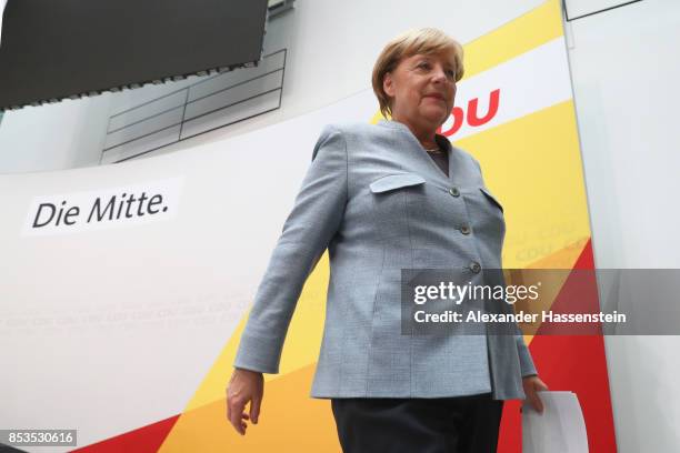 German Chancellor and Christian Democrat Angela Merkel arrives at CDU headquater to speak to the media the day after the CDU won 32.9% of the vote...