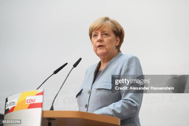 German Chancellor and Christian Democrat Angela Merkel speaks to the media at CDU headquateron the day after the CDU won 32.9% of the vote and a...