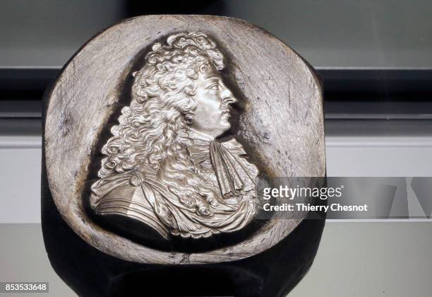 Steel stamp representing French King Louis XIV is displayed during the press visit at the "Monnaie de Paris" on September 25, 2017 in Paris, France....