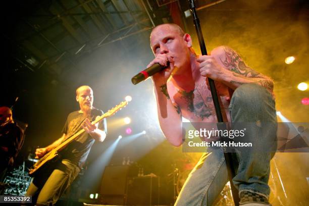 Photo of STONE SOUR and Corey TAYLOR and Shawn ECONOMAKI; Shawn Economaki and Corey Taylor performing live onstage