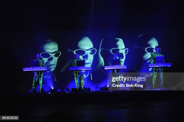 Photo of KRAFTWERK and Ralf HUTTER and Henning SCHMITZ and Fritz HILPERT and Stefan PFAFFE, Group performing on stage L-R. Ralf Hutter, Henning...