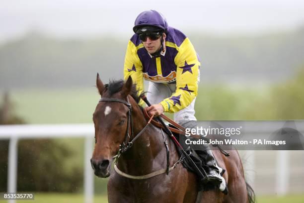 Eastern Dragon ridden by Jack Duern comes home to win The TJ Group Apprentice Handicap during day one of the May Festival at Goodwood Racecourse,...