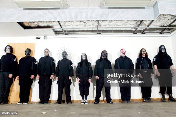 Photo of SLIPKNOT and Chris FEHN and Shawn CRAHAN and Sid WILSON and Craig JONES and Corey TAYLOR and Mick THOMSON and Joey JORDISON and Paul GRAY...