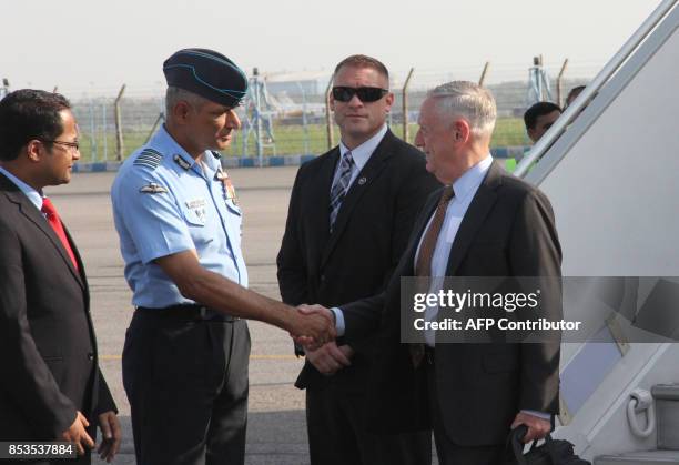 Defence Secretary Jim Mattis is met by Indian and US officials after arriving at the start of an official visit to India in New Delhi on September...