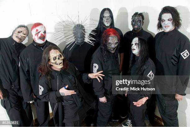 Photo of SLIPKNOT and Chris FEHN and Shawn CRAHAN and Sid WILSON and Craig JONES and Corey TAYLOR and Mick THOMSON and Joey JORDISON and Paul GRAY...