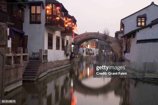 watertown's stone bridge viewed at dusk - zhujiajiao stock pictures, royalty-free photos & images