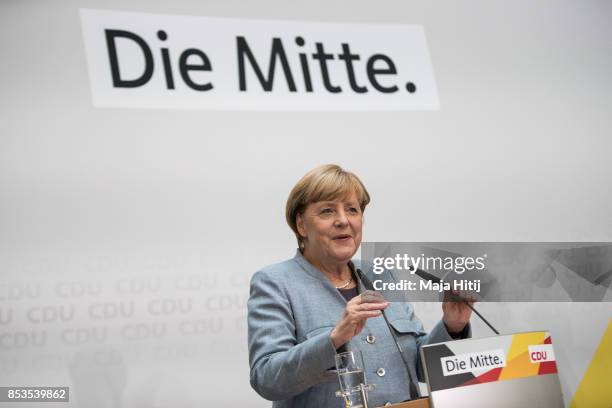 German Chancellor and Christian Democrat Angela Merkel gives a statement to the media the day after the CDU won 32.9% of the vote and a first place...