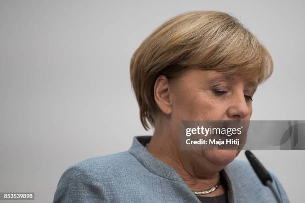 German Chancellor and Christian Democrat Angela Merkel gives a statement to the media the day after the CDU won 32.9% of the vote and a first place...