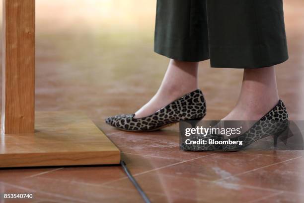 Theresa May, U.K. Prime minister, stands in leopard-print kitten-heel shoes as she speaks at Complesso Santa Maria Novella in Florence, Italy, on...