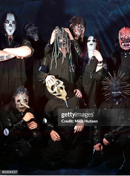 Photo of SLIPKNOT and Chris FEHN and Shawn CRAHAN and Sid WILSON and Craig JONES and Corey TAYLOR and Mick THOMSON and Joey JORDISON and Paul GRAY...