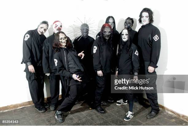 Photo of SLIPKNOT and Chris FEHN and Shawn CRAHAN and Sid WILSON and Craig JONES and Corey TAYLOR and Mick THOMSON and Joey JORDISON and Paul GRAY...