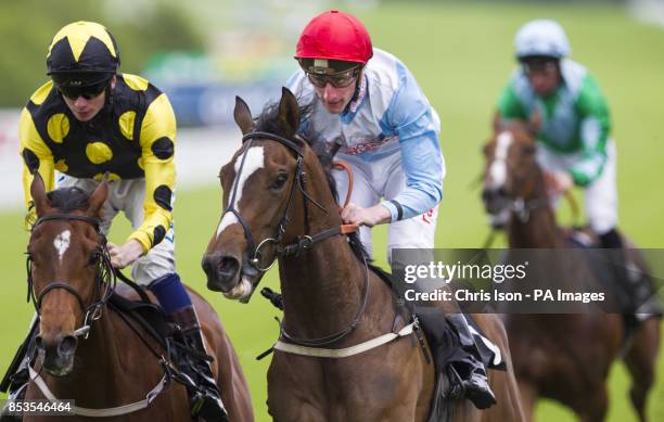 Adam Kirby on Showcard wins the ebfstallions.com Maiden Fillies Stakes from William Twiston-Davies on Exentricty during day three of the May Festival...