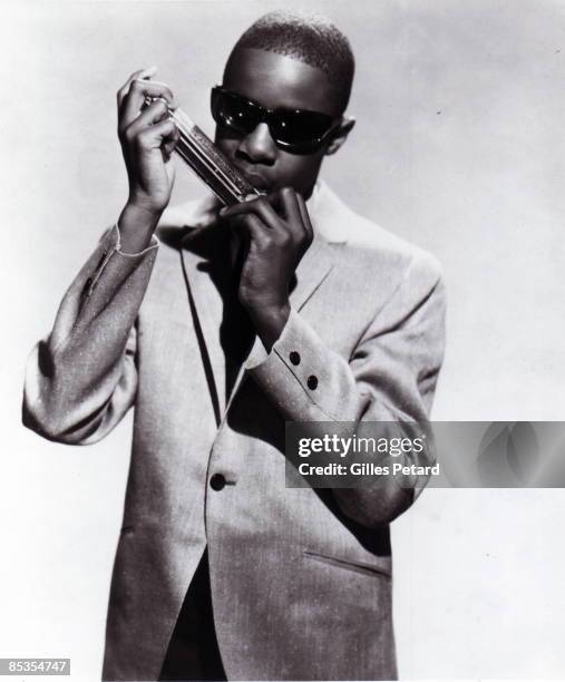 Photo of Stevie WONDER; Posed studio portrait of Stevie Wonder, harmonica