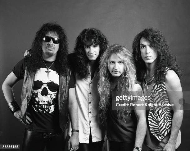 Photo of KISS and Gene SIMMONS and Paul STANLEY and Bruce KULICK and Eric SINGER; Posed group portrait at their RockWalk induction L-R Gene Simmons,...