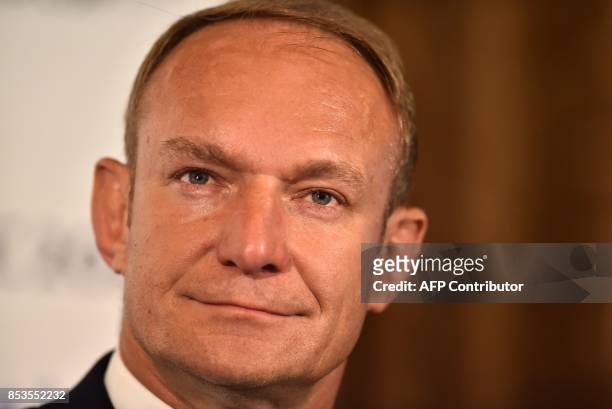 Former South African rugby international Francois Pienaar takes part in a press conference after South Africa presented their bid to host the 2023...
