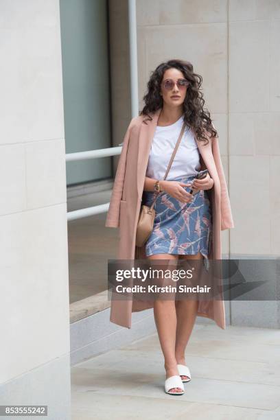 Fashion blogger Roxie Nafousi wears Moncler sunglasses, Gucci bag, New Look jacket and shoes and a Never fully dressed skirt and top on day 1 of...