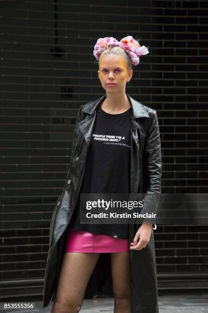 Model and DJ Fabienne Hebrard wears a Miss Guided skirt, Clash Magazine T shirt, Marks and Spencers coat on day 1 of London Womens Fashion Week...