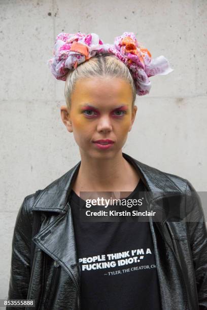 Model and DJ Fabienne Hebrard wears a Clash Magazine T shirt and a Marks and Spencers coat on day 1 of London Womens Fashion Week Spring/Summer 2018,...