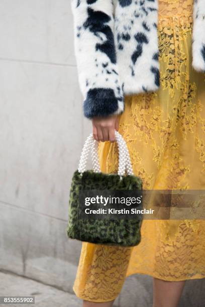 Model and Actress Betty Bachz wears a Shrimps coat, bag and dress on day 1 of London Womens Fashion Week Spring/Summer 2018, on September 15, 2017 in...